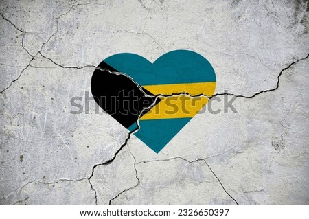 The symbol of the national flag of Bahamas in the form of a heart on a cracked concrete wall. Concept.