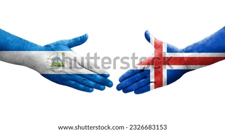 Handshake between Iceland and Nicaragua flags painted on hands, isolated transparent image.