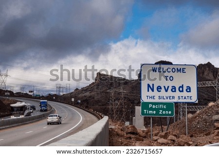Welcome to Nevada road sign with
traffic in 4k