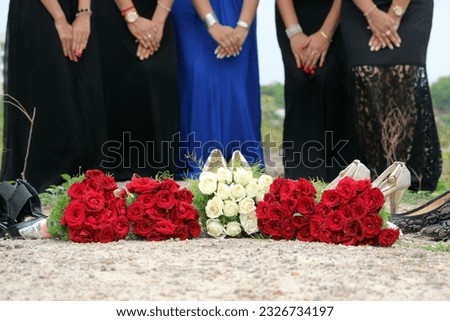 bridesmaid concept with red and white roses. Bride to be in blue and other girls in black gown. wedding theme photo background or thumbnail. Christiaan wedding style.