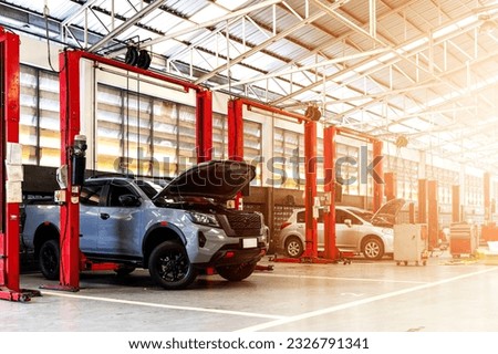 automotive care at our renowned service center. Our skilled mechanics offer top-notch car repair, industry-leading maintenance, and personalized service. Royalty-Free Stock Photo #2326791341