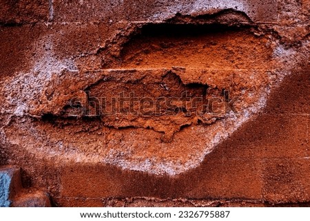 red and old deflationary porous red brick wall close up view background photo