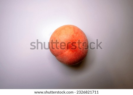 Close-up shot of peach on a white background