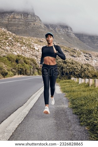 Fitness, black woman running and mountain in forest background for exercise. Workout or health wellness, motivation and body of female athlete training run for marathon in nature with sportswear