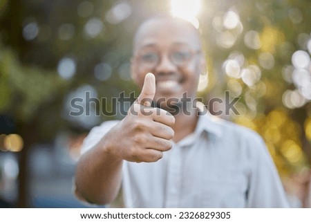 Black man, hands and thumbs up in park for success, good job or approval in the nature outdoors. Portrait of happy African male person show thumb emoji, yes sign or like for agreement or deal outside