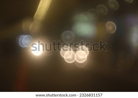 Bokeh or blur image of park lights and cars in Blok M, South Jakarta, Indonesia, January 9, 2023 Royalty-Free Stock Photo #2326831157