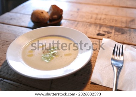 A plate of potato and edamame soup.