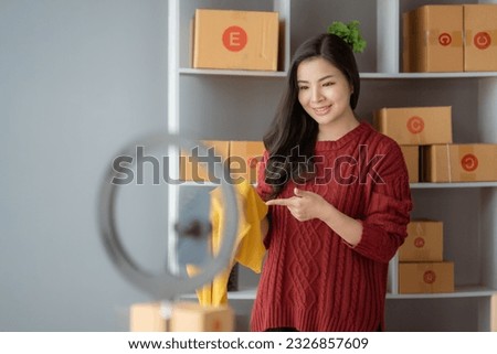 Starting Small business entrepreneur SME freelance, Portrait young woman working at home office, BOX, smartphone, laptop, online, marketing, packaging, delivery, b2b, SME, e-commerce concept..