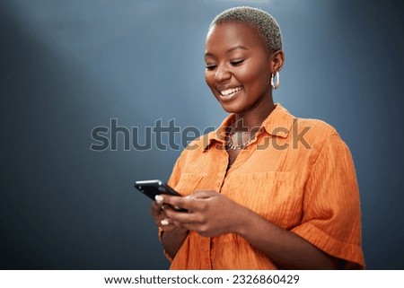 Phone, texting and happy black woman in studio for social media, app or communication on grey background. Smartphone, search and African female smile for meme, post or online dating notification