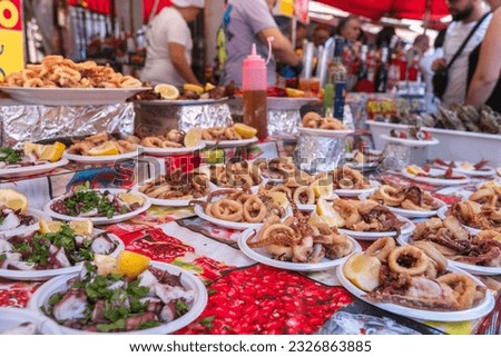 Grilled seafood at the food market Ballaro in Palermo Sicily Royalty-Free Stock Photo #2326863885