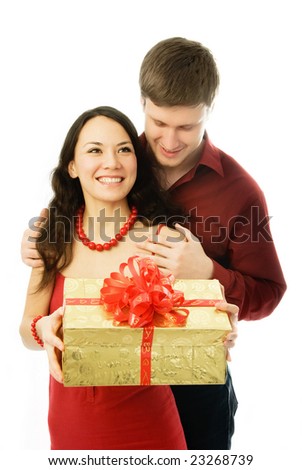 happy couple, young man gives a present ot his wife
