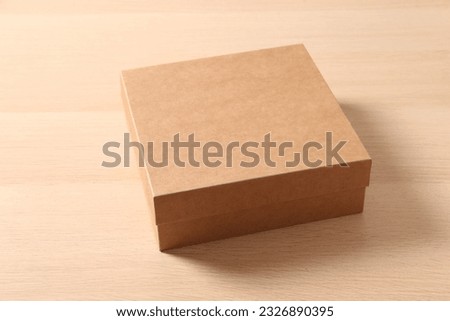 cardboard box on wooden background