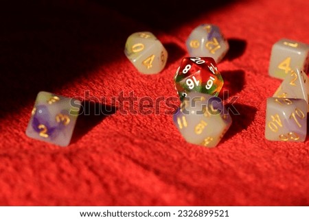 Close up of dice on a red background.