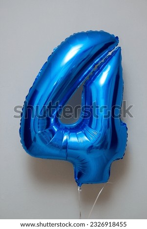 blue balloon number 4 on white background