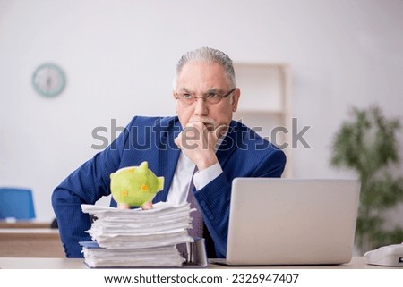 Old male employee in planning retirement concept Royalty-Free Stock Photo #2326947407