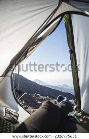View from a tent on the slope of Mount Ararat in the early morning in the mountains in sunny weather