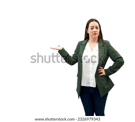 Annoyed young brunette business woman doing a hand gesture to one side against a white background