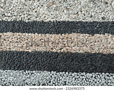 texture of black and white small stones on the floor