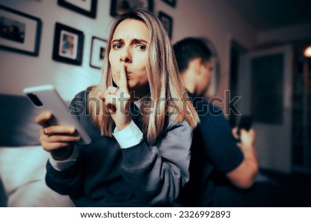 
Woman Cheating on her Partner Using online Dating Apps
Secretive girlfriend hiding an extramarital internet affair 
 Royalty-Free Stock Photo #2326992893