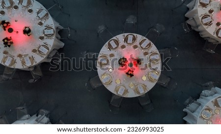 Cinematic image, scenery and flowers at a gala dinner. Luxurious wedding. Banquet arrangement. Table server. Round table. Drone footage. Party Hall Royalty-Free Stock Photo #2326993025