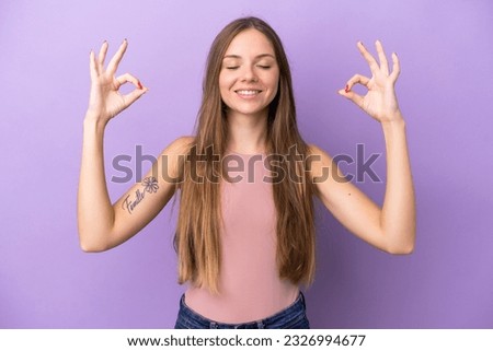 Young Lithuanian woman isolated on purple background in zen pose