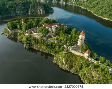 Aerial view of early Gothic Zvikov castle on difficult-to-access and steep promontory above the confluence of the Vltava and Otava rivers in Bohemia Royalty-Free Stock Photo #2327000375