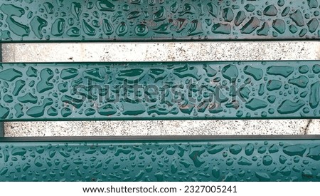 illustrated raindrops on green iron bars as abstract artistic background template 