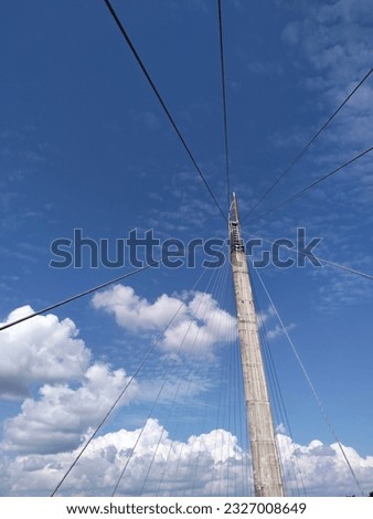 Beautiful blue sky , with a tall pillar of the bridge 