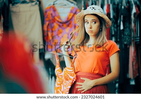 
Woman Feeling Bloated Thinking and Choosing a Bathing Suit. Stressed girl feeling self-conscious buying swimsuits 

 Royalty-Free Stock Photo #2327024601