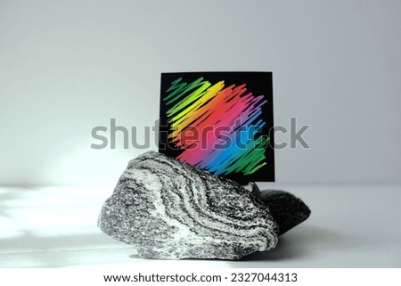 Blank black paper poster with scratch colorful rainbow lines,   marble stone podium. Template mock up for adding design, text