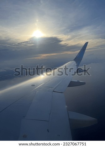 Frontier Airlines Window photos; Flying over the Atlantic Ocean Royalty-Free Stock Photo #2327067751