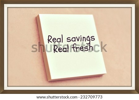 Text real savings real fresh on the short note texture background