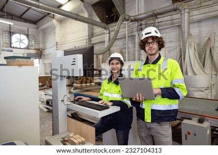 portrait young man and women engineer worker team work service support together in industry technology production machine plywood furniture factory