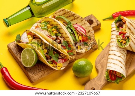 Mexican food featuring tacos, burritos, nachos, burgers and more Royalty-Free Stock Photo #2327109667