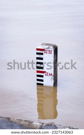 selective focus picture of water level marking in a river