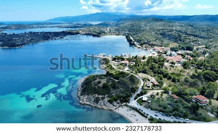 Aerial 4k photo of the Aegean Sea shot in Greece on Ormos Panagias beach. 