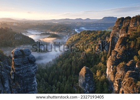 morning foggy atmosphere in the Saxony Switzerland, national park, germany Royalty-Free Stock Photo #2327193405