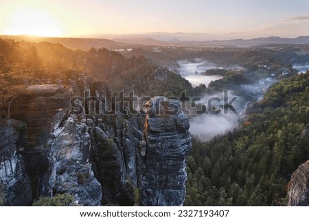 morning foggy atmosphere in the Saxony Switzerland, national park, germany Royalty-Free Stock Photo #2327193407