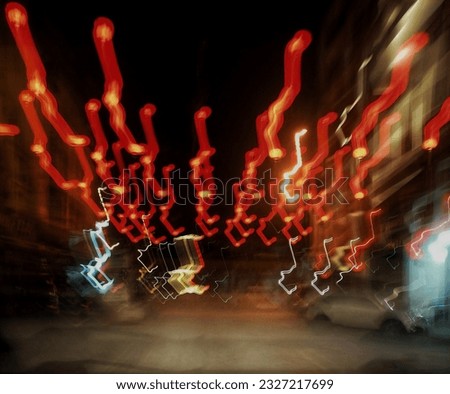 Photo of car lights at night, using slow speed technique.



