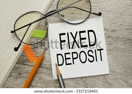 Fixed Deposit workspace with text on white sticker. Royalty-Free Stock Photo #2327218401