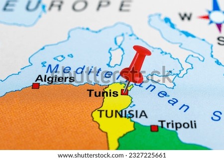 Close up of Tunis map with red pin. 
