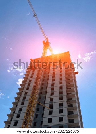 New house for many families, babies and new life, building multi storey building as symbol of hope to better life. Vertical photo