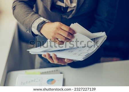 Business Documents, Asian male businessman, auditor examining legal documents, preparing documents or reports for analysis, tax time, accountants dealing data documents in office at work