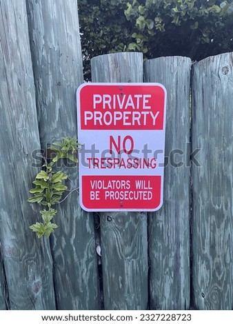 Private Property No Trespassing Sign on a Post Fence