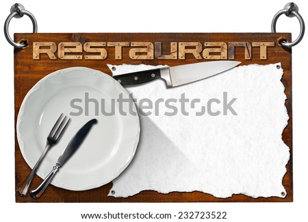 Restaurant Signboard with clipping path / Advertising dark wooden sign with clipping path for a restaurant with a white empty sheet of paper, kitchen knife, empty white plate and silver cutlery