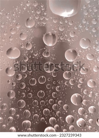 Water bubbles droplets have light orange black background.