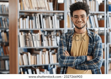 Student standing in library at college