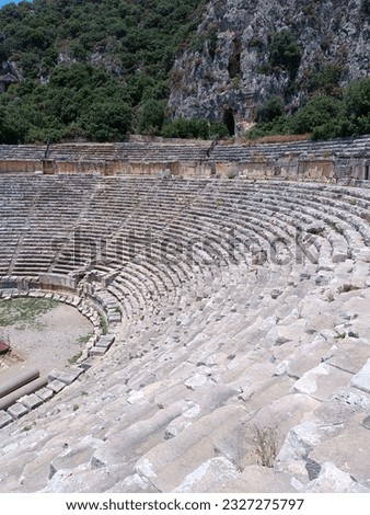 The ancient theater and stairs in its greenery
