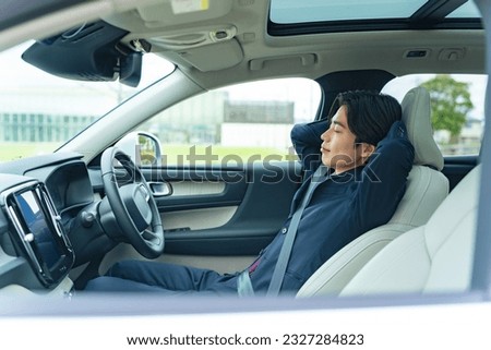 Driver sleeping in a car. Autonomous car. Self-driving vehicle. Break. Sleeping in the car. Royalty-Free Stock Photo #2327284823