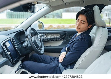 Driver sleeping in a car. Autonomous car. Self-driving vehicle. Break. Sleeping in the car. Royalty-Free Stock Photo #2327284829